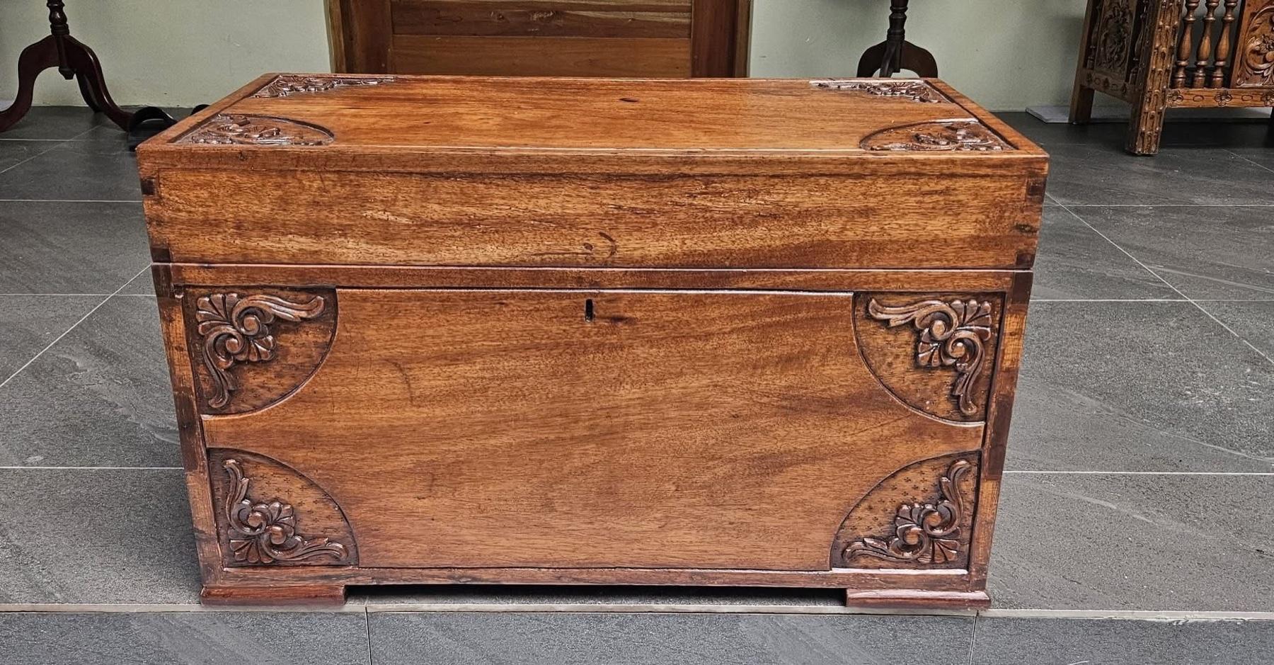 An antique wood chest after restoration.