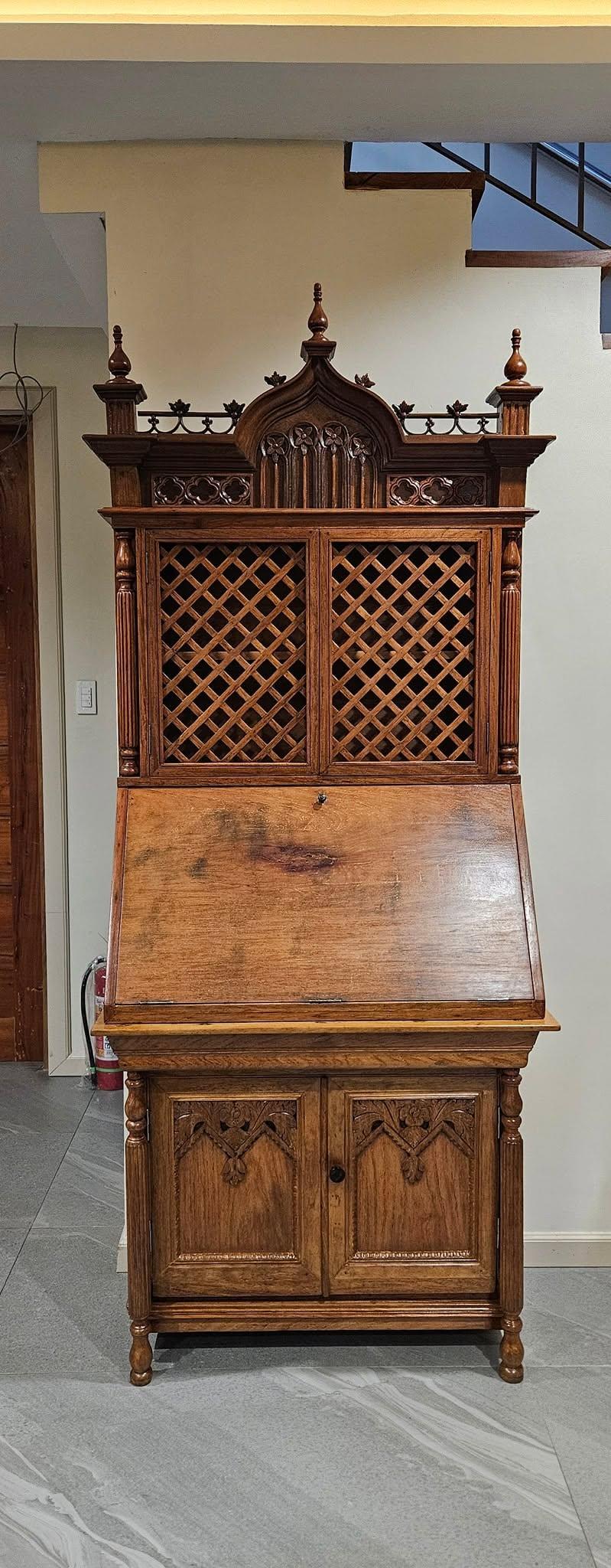 Restored wood escritorio with lattice doors and carved crown